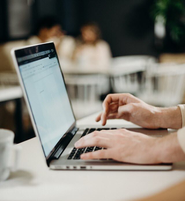 Person typing on laptop